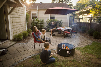 Portrait of a family eating together in back yard