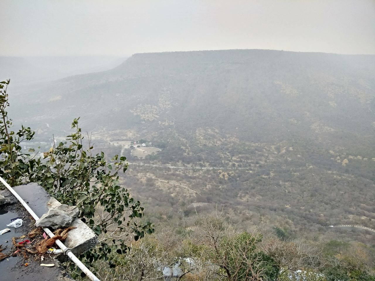 HIGH ANGLE VIEW OF TREES AND MOUNTAINS AGAINST SKY