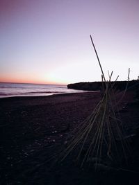 Scenic view of beach against sky during sunset