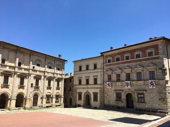 Low angle view of historic building against clear blue sky