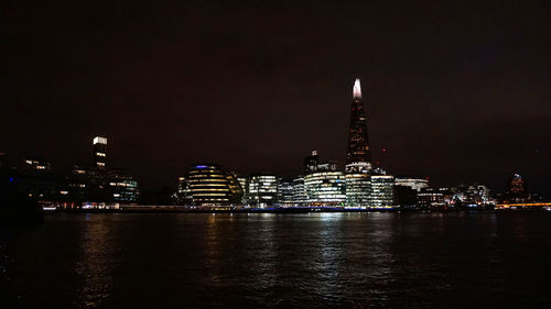 Illuminated buildings in city at night