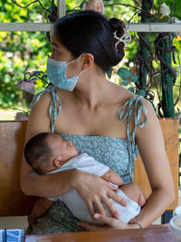 Woman and baby asian and nationality thai is happy feel