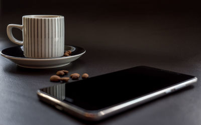 Close-up of coffee cup on table