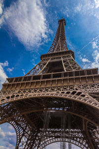 Low angle view of tower against cloudy sky