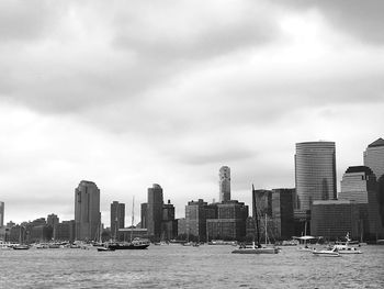 City skyline against cloudy sky