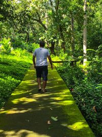 Full length of woman walking on footpath