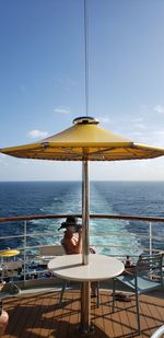 Scenic view of swimming pool by sea against sky