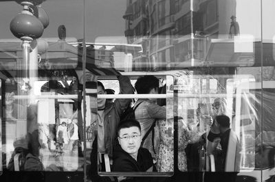 Reflection of people on glass window