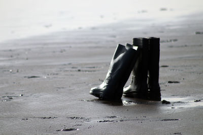 Boots on sand at beach