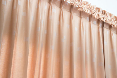 Curtain hanging in bedroom at home