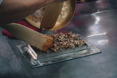 High angle view of person preparing food on table