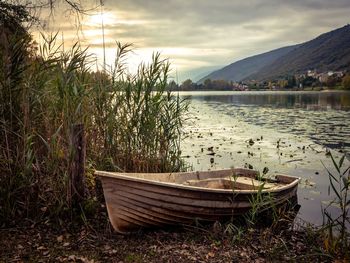 Scenic view of lake against sky during sunset