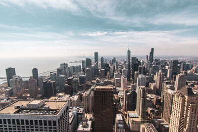 High angle view of buildings in city against sky