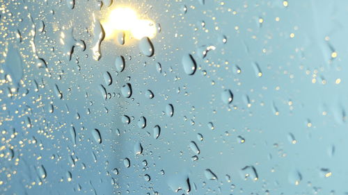 Full frame shot of raindrops on window