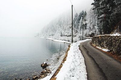 Scenic view of frozen lake against sky during winter