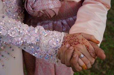 High angle view of woman hands clasped