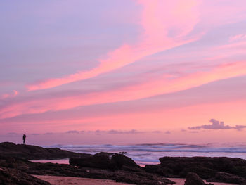 Scenic view of sea against sky at sunset