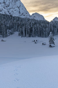 Scenic view of snow covered mountains against sky