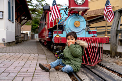 Portrait of boy sitting outdoors