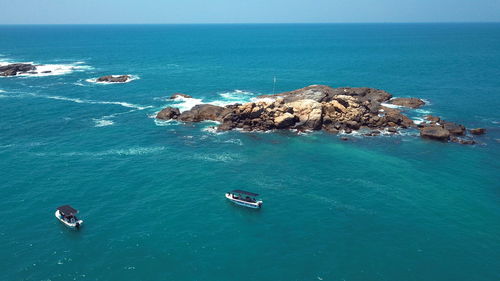 High angle view of rocks in sea