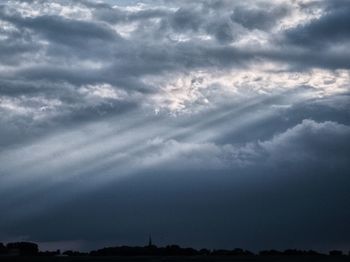 Low angle view of silhouette landscape against sky