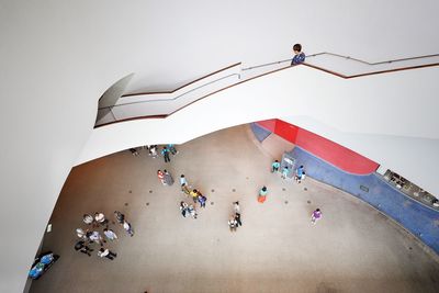 High angle view of people relaxing against the sky