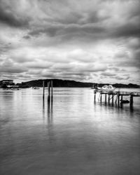 Pier on sea against sky