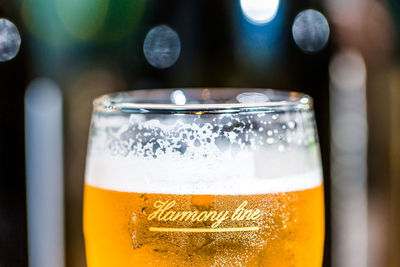 Close-up of beer glass on table