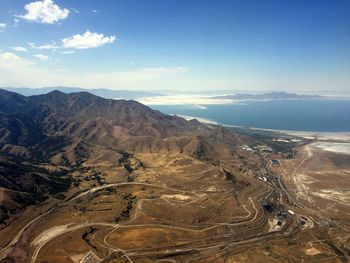 High angle view of mountains by sea