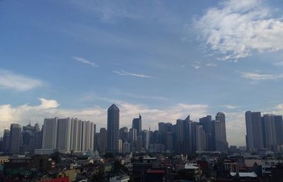 Modern buildings in city against sky