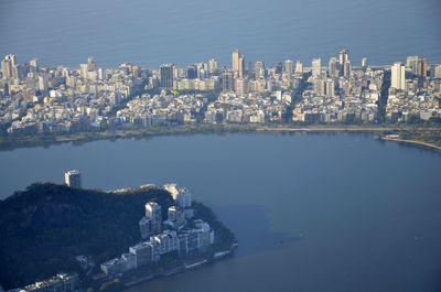 Aerial view of city amidst sea