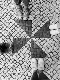 Low section of people standing on footpath