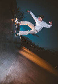 Low section of man skateboarding on skateboard