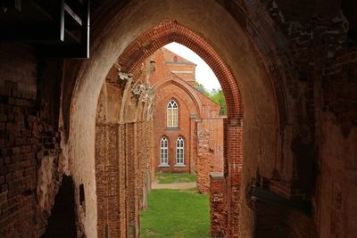 Building seen from archway at tartu cathedral