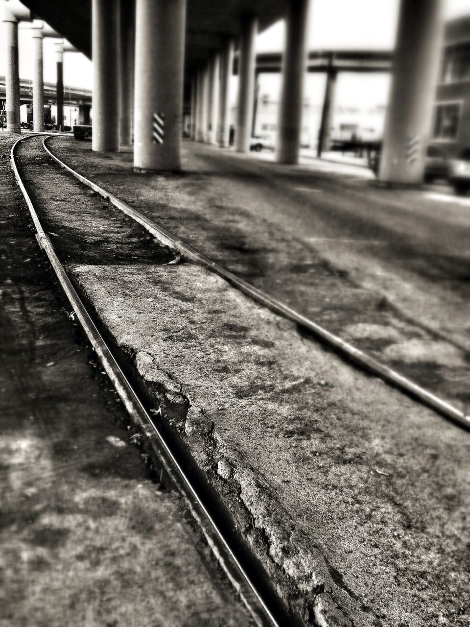 railroad track, transportation, built structure, architecture, the way forward, rail transportation, diminishing perspective, public transportation, vanishing point, railing, railroad station platform, architectural column, metal, surface level, railroad station, day, no people, connection, travel, empty