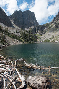 Scenic view of lake and mountains against sky