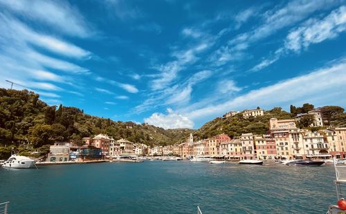 Buildings by sea against sky in portofino