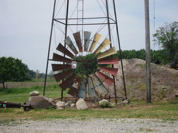 Damaged american-style windmill on field