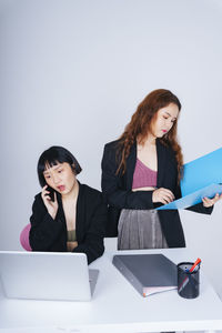 Young woman using mobile phone