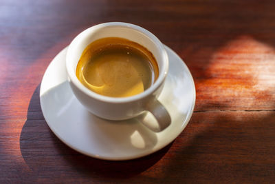 High angle view of coffee cup on table