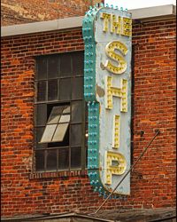 Low angle view of text on brick wall