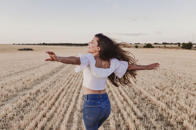 Full length of woman standing on field