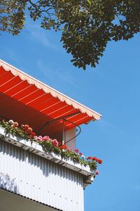 Balcony in germany with geranium flower boxes and marquee or awning - stay at home or staycation 