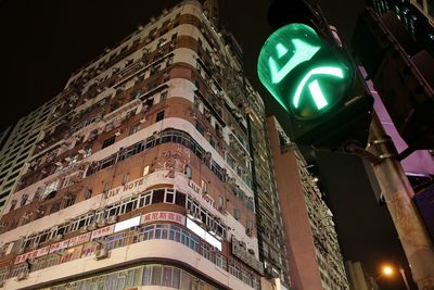 Low angle view of illuminated building at night