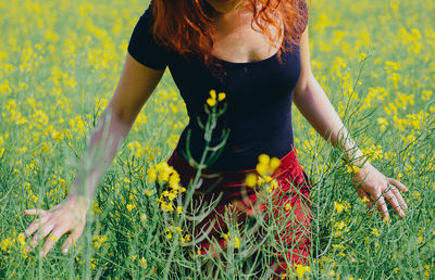 Woman standing on field