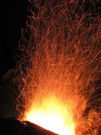 Low angle view of fire crackers at night