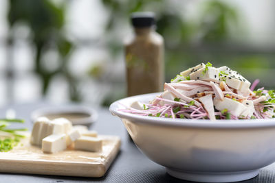 Close-up of chopped in bowl on table