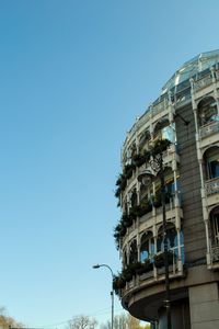 Low angle view of building against clear blue sky