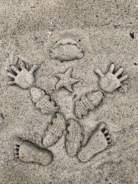 Close-up of footprints on sand