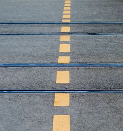 High angle view of yellow crossing on road